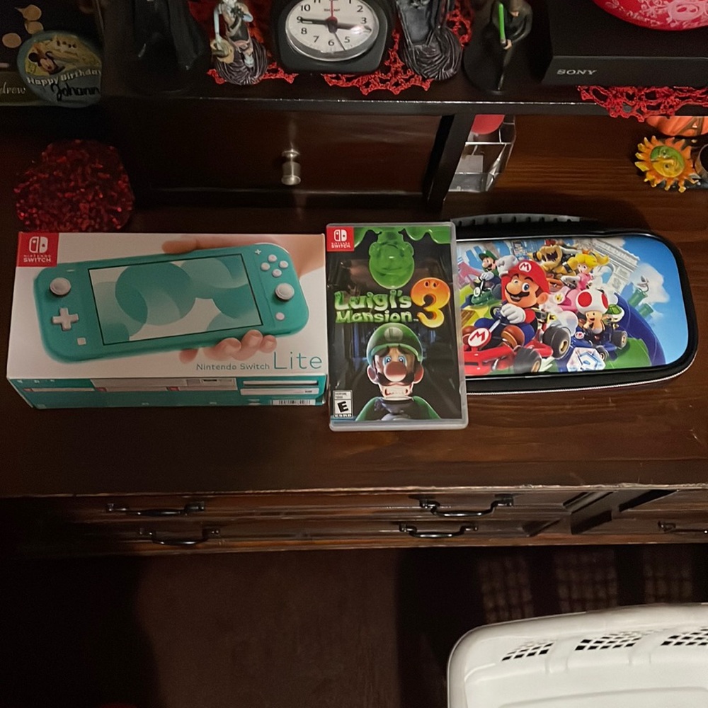 Nintendo Switch Lite handheld game counsel with one game included and case